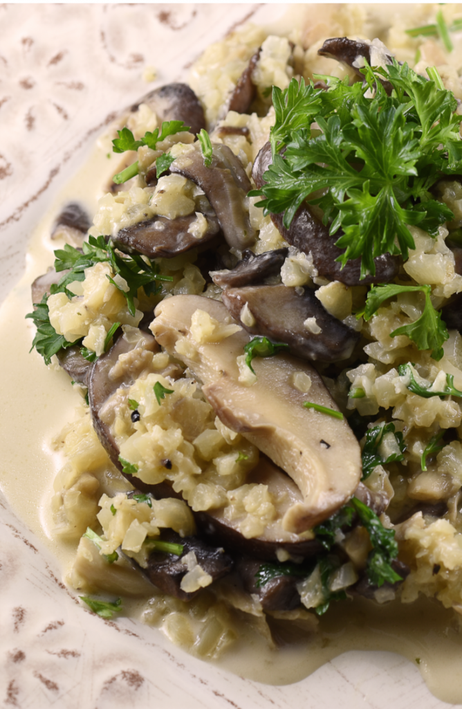 If you haven't used riced cauliflower when cooking, then you're missing out! Check out these delicious riced cauliflower recipes! This vegan riced cauliflower mushroom risotto is incredible! 